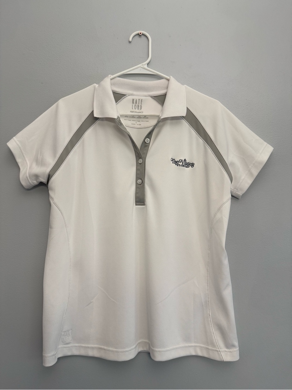 Kate Lord Performance Golf Polo White & Gray The Villages Florida Logo
